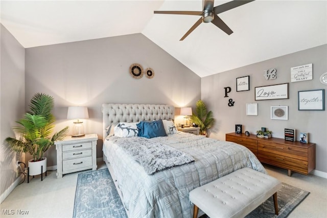 bedroom with ceiling fan, light carpet, and vaulted ceiling