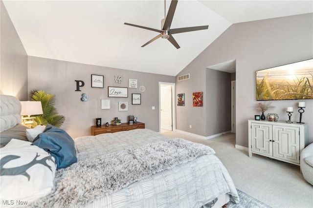 carpeted bedroom featuring vaulted ceiling and ceiling fan