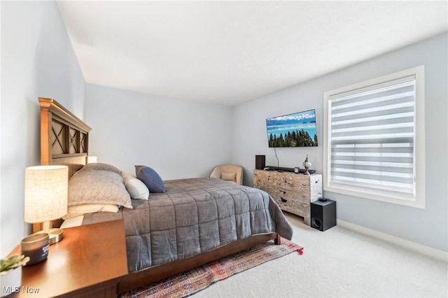 bedroom featuring carpet floors and multiple windows