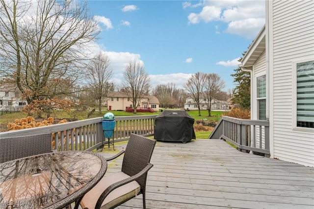 wooden terrace with area for grilling