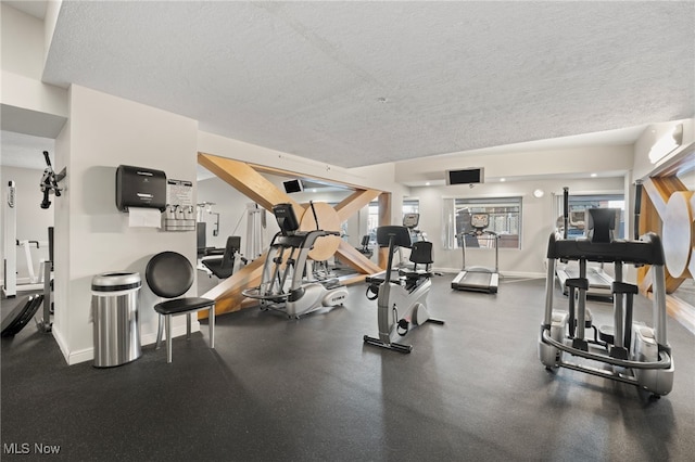 workout area with a textured ceiling