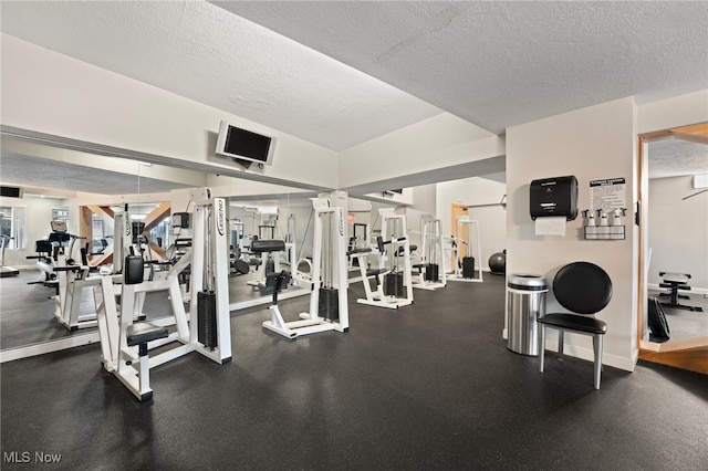 workout area featuring a textured ceiling