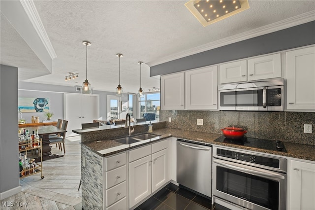 kitchen with white cabinets, stainless steel appliances, and sink