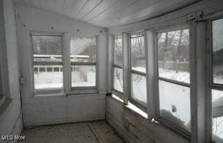 unfurnished sunroom featuring vaulted ceiling and wood ceiling