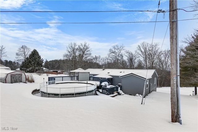 exterior space with a shed and a deck