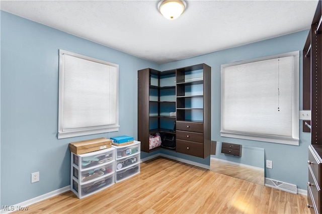 bedroom with wood-type flooring