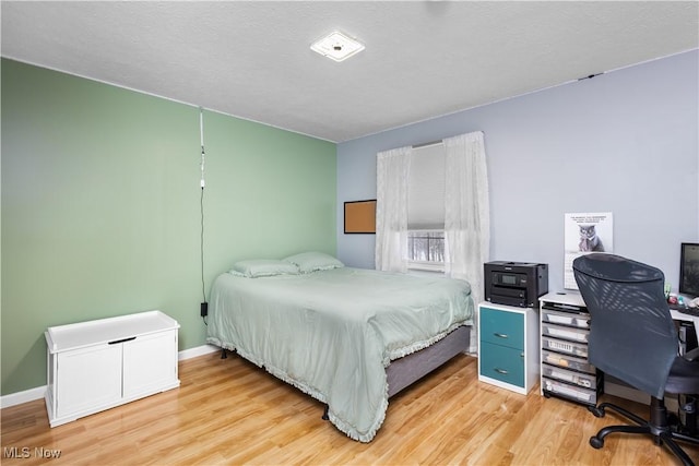 bedroom featuring light wood-type flooring