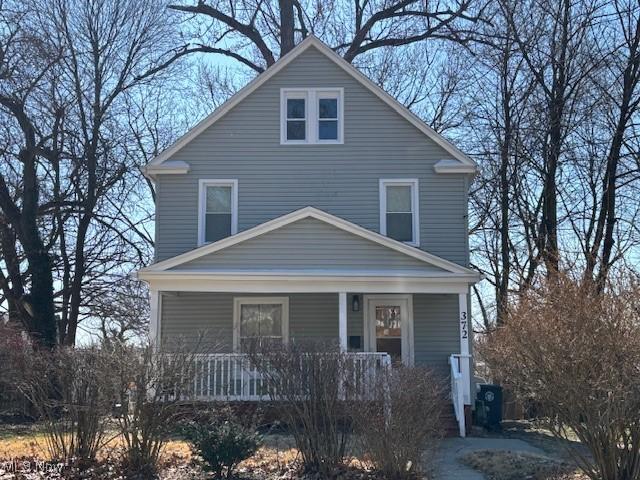 traditional style home with covered porch