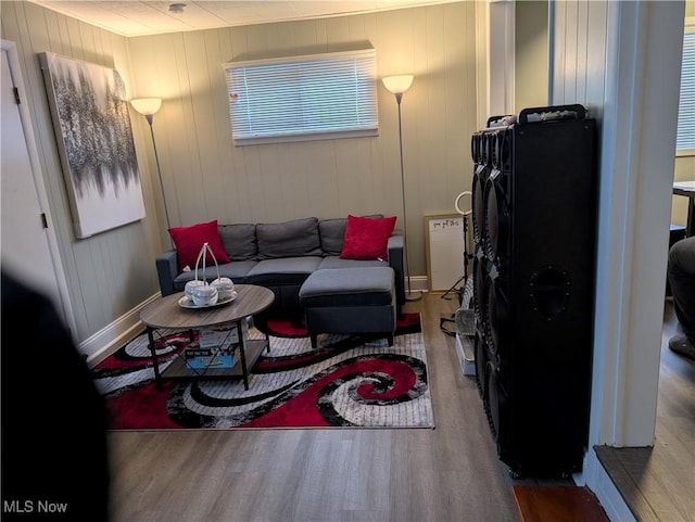 living room with hardwood / wood-style flooring and radiator heating unit