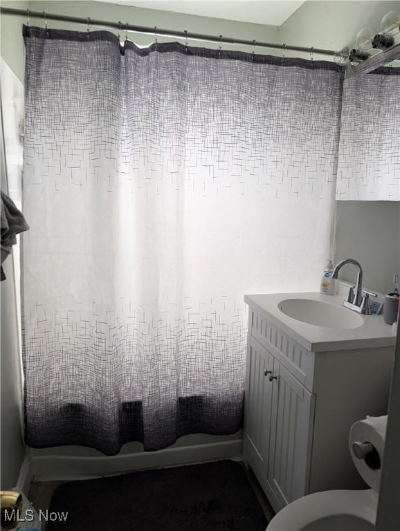 bathroom with vanity and a shower with shower curtain