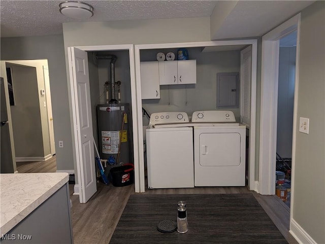 clothes washing area featuring cabinets, gas water heater, dark hardwood / wood-style floors, independent washer and dryer, and a textured ceiling