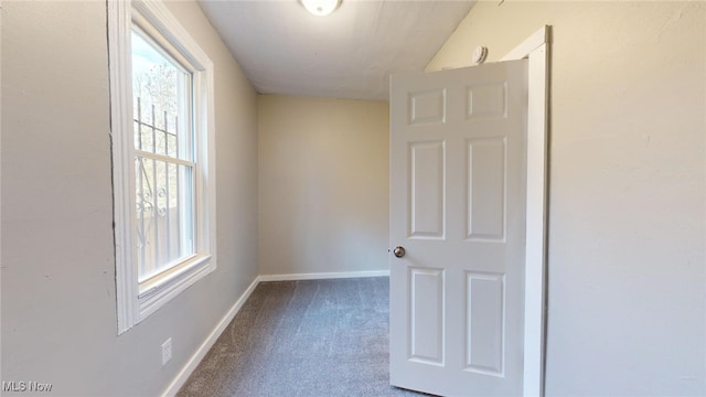 unfurnished room with carpet flooring