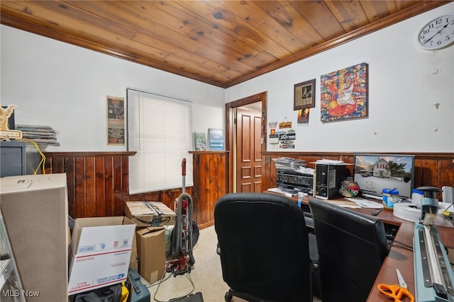 carpeted home office with wood ceiling, wood walls, ornamental molding, and wainscoting