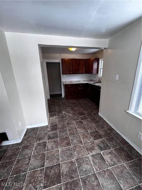 kitchen featuring sink and backsplash