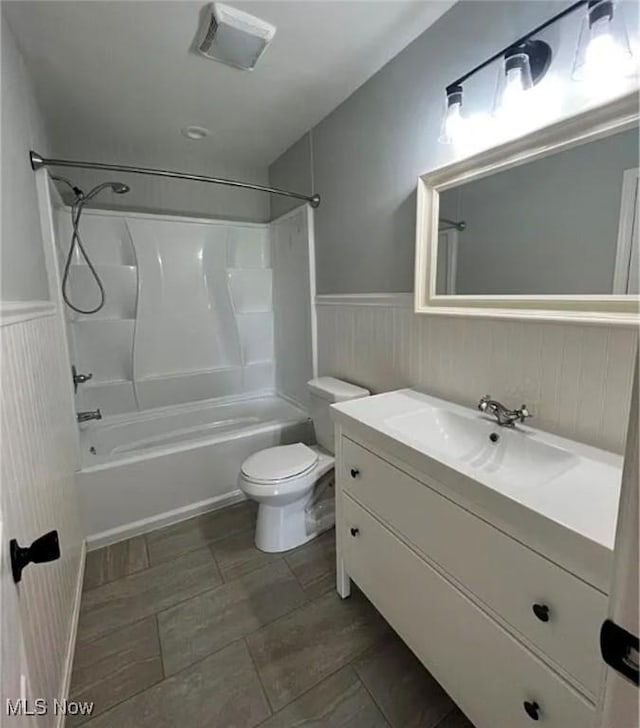 full bathroom with vanity,  shower combination, and toilet