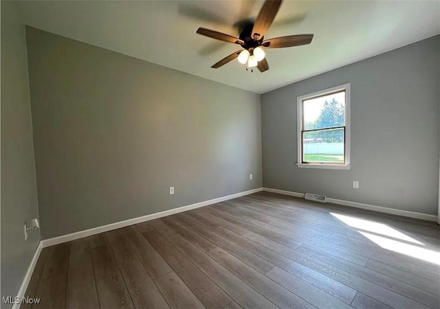 unfurnished room featuring hardwood / wood-style flooring and ceiling fan