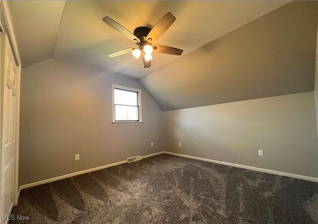 bonus room featuring carpet flooring, ceiling fan, and vaulted ceiling