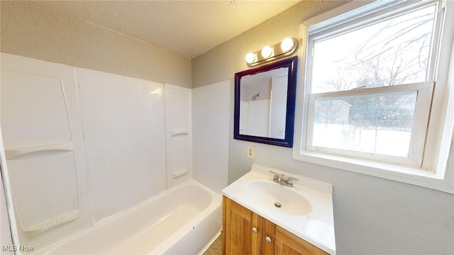 bathroom with vanity and bathing tub / shower combination