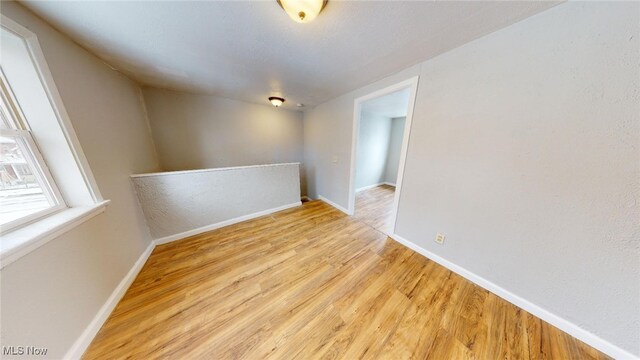 unfurnished room with light hardwood / wood-style floors