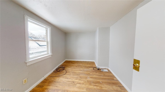 empty room with light hardwood / wood-style floors