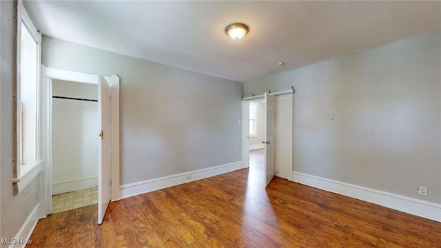 unfurnished bedroom featuring hardwood / wood-style floors