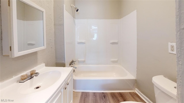 full bathroom featuring shower / bathing tub combination, vanity, toilet, and wood-type flooring