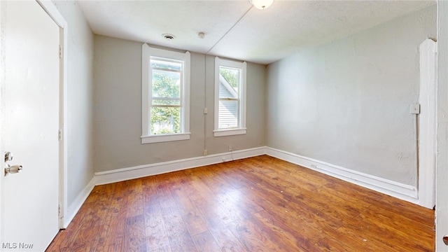 unfurnished room featuring wood-type flooring