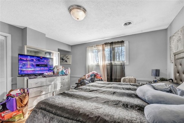 bedroom featuring a textured ceiling