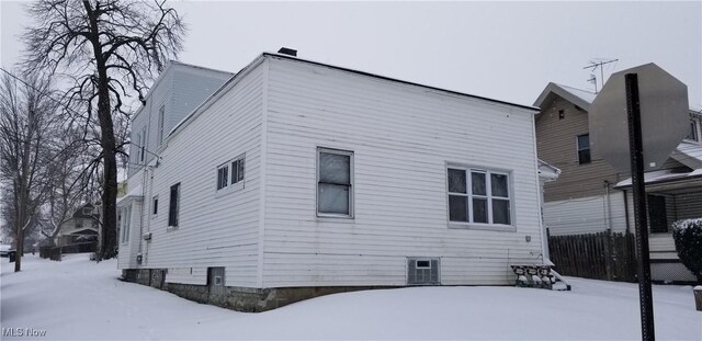 view of snow covered property