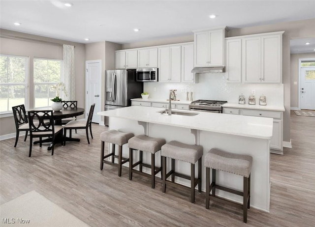 kitchen featuring white cabinets, sink, and stainless steel appliances