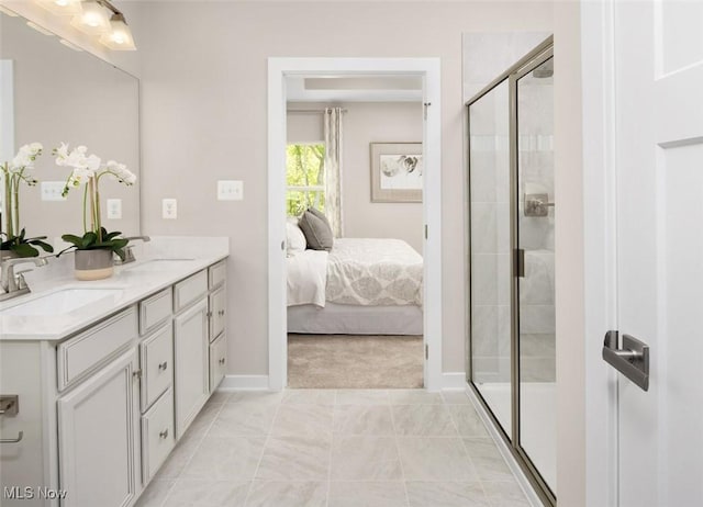 bathroom with vanity, tile patterned floors, and an enclosed shower