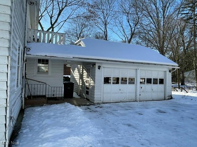 view of snow covered garage