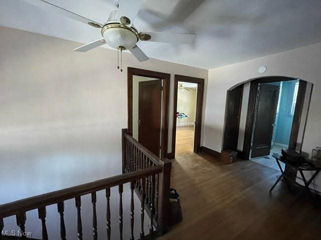 hallway with dark wood-type flooring