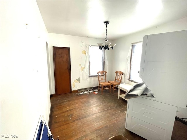 interior space with dark hardwood / wood-style flooring and a chandelier