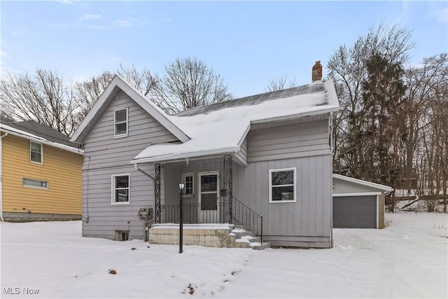 view of front of home with an outdoor structure and a garage