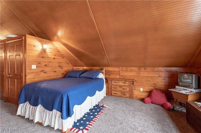 bedroom with wooden walls, carpet floors, wood ceiling, and vaulted ceiling