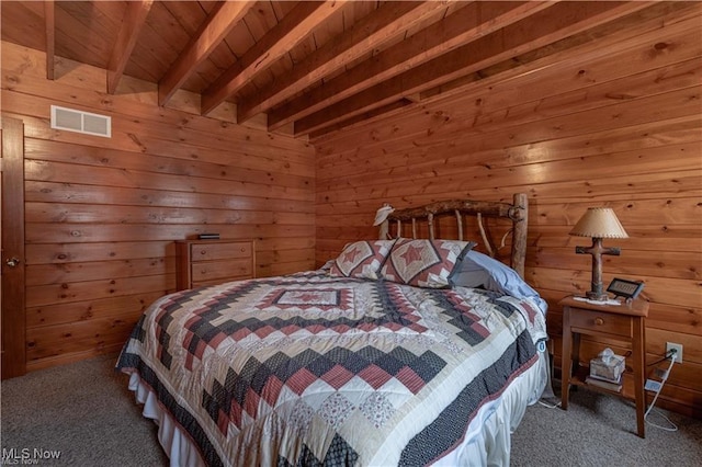 carpeted bedroom featuring beam ceiling, wood walls, and wooden ceiling