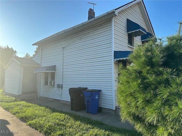3978 E 89th St, Cleveland, OH 44105 - view of property exterior with a chimney
