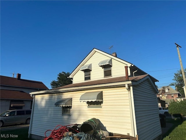 3978 E 89th St, Cleveland, OH 44105 - view of property exterior featuring a chimney