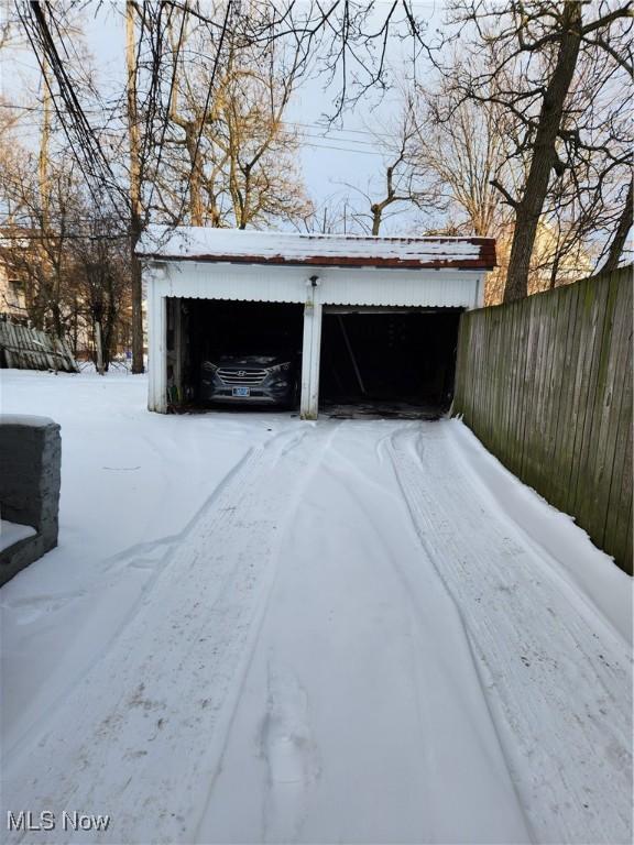 view of snow covered garage