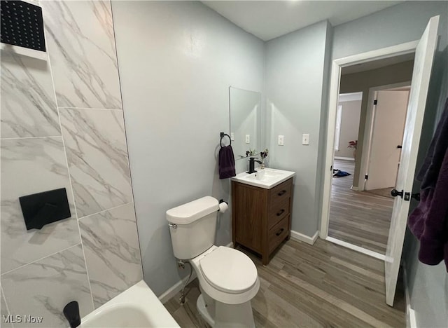 bathroom with hardwood / wood-style flooring, vanity, and toilet