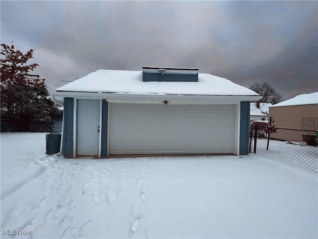 view of snow covered garage