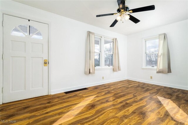 entryway featuring ceiling fan and dark wood-type flooring