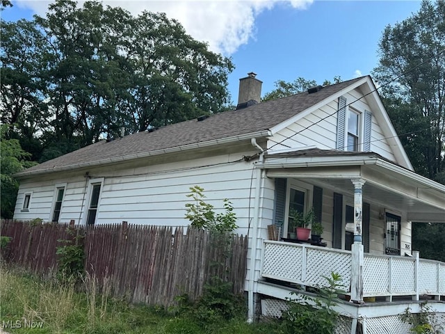 view of property exterior with a porch