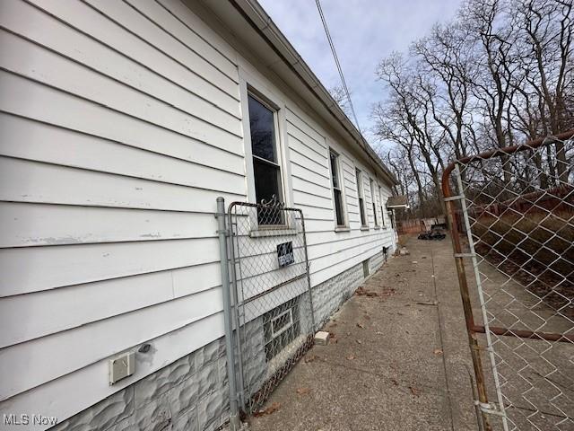 view of property exterior featuring fence