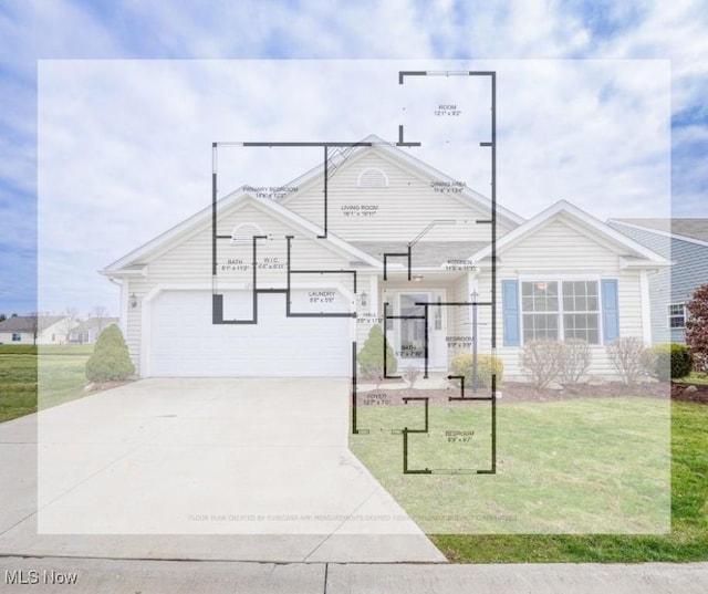 view of front of property with a front yard and a garage