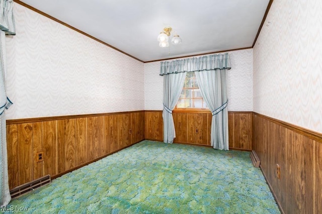 carpeted spare room with ornamental molding