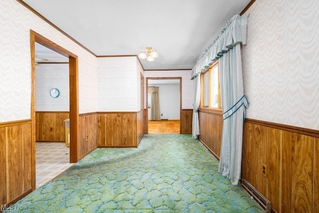 hallway featuring crown molding and light carpet