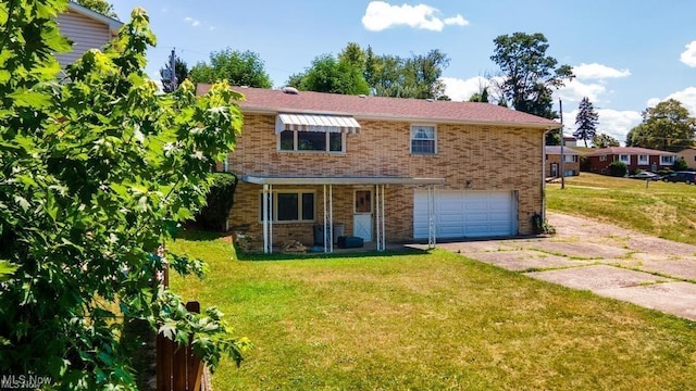 view of front of house featuring a garage and a front yard