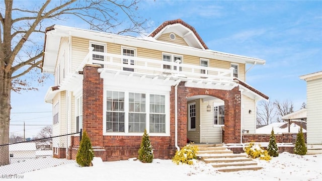 view of front of home with a balcony